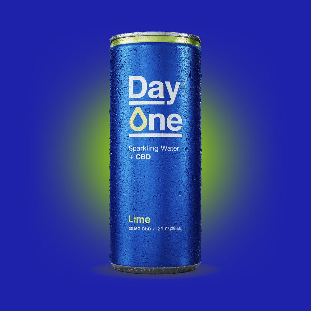 Cans of Day One Sparkling Water + CBD in lime flavor