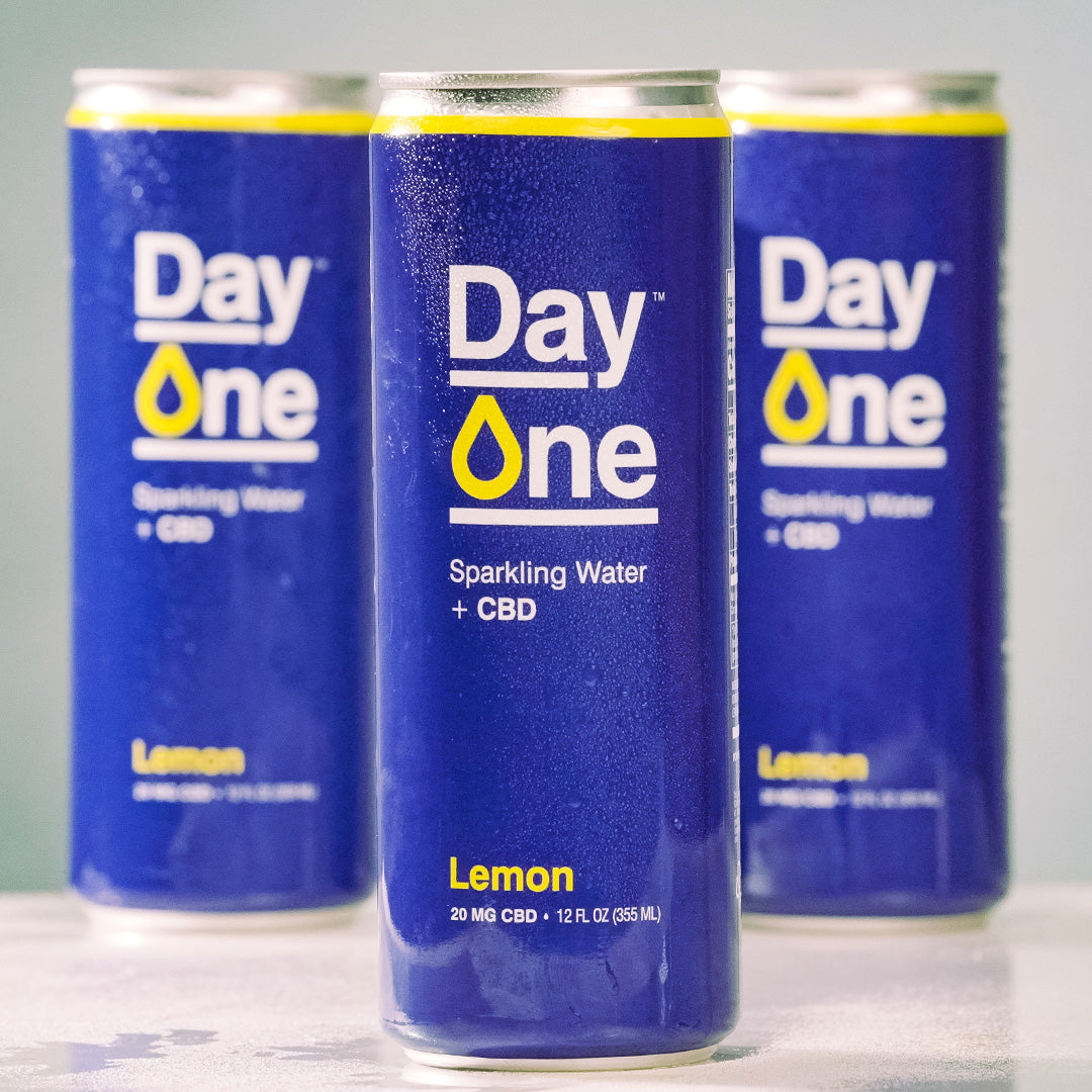 Three Day One cans of Sparkling Water + CBD in lemon flavor