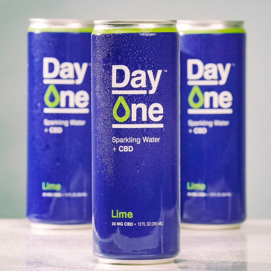 Three Day One cans of Sparkling Water + CBD in lime flavor