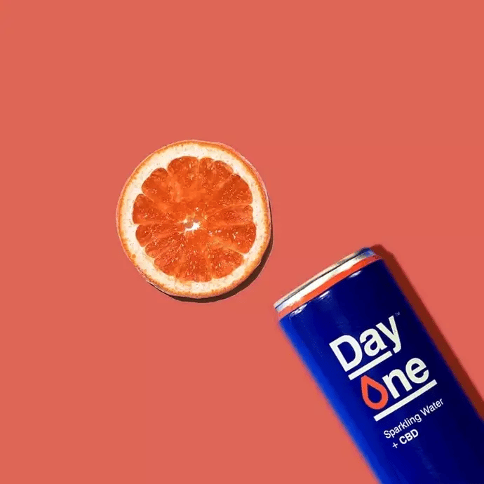 A can of Grapefruit CBD Sparkling Water with grapefruit slices
