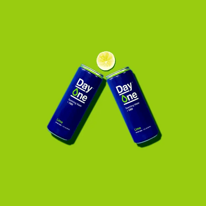 Two cans of CBD sparkling water with lime slices moving
