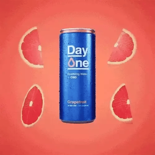 A Day One Grapefruit CBD can with Graprfruit scattered around