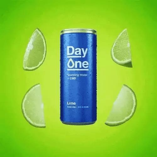 A Day One Lime CBD can with Limes scattered around